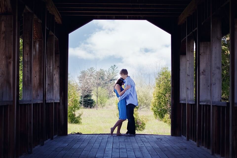 hugging in barn