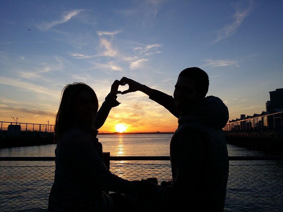 heart shape hands sunset